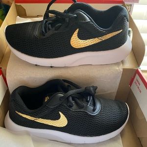 Black and Gold: Girls Nike Shoes. Never worn.